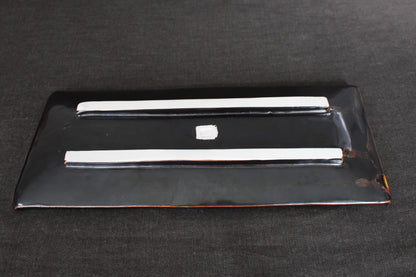 sushi plate with tenmoku glaze bottom view