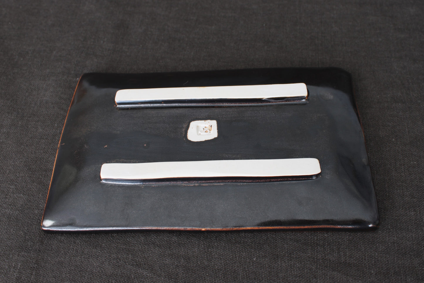 sushi plate with tenmoku glaze bottom view